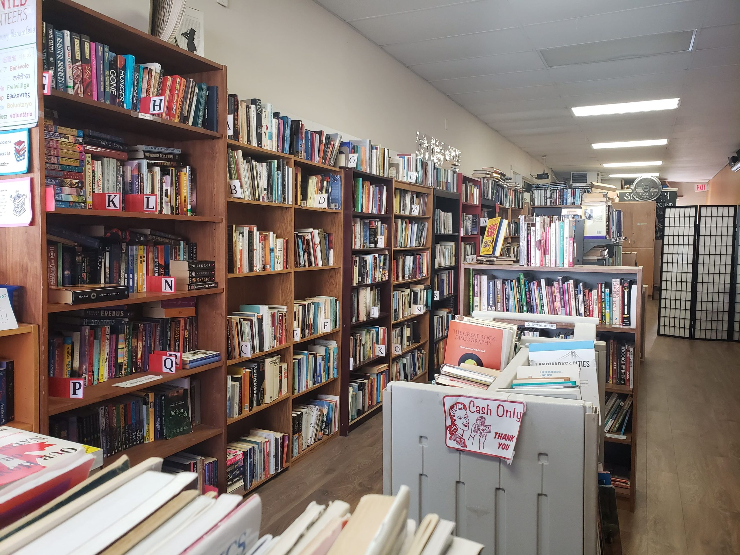 A long wall full of books on shelves
